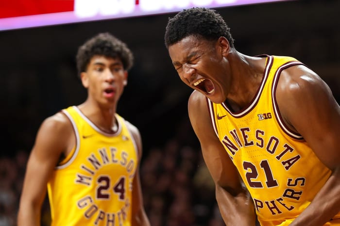 Feb 3, 2024; Minneapolis, Minnesota, USA; Minnesota Golden Gophers forward Pharrel Payne (21) celebrates after blocking a shot against Northwestern Wildcats center Matthew Nicholson (34) during the second half at Williams Arena.